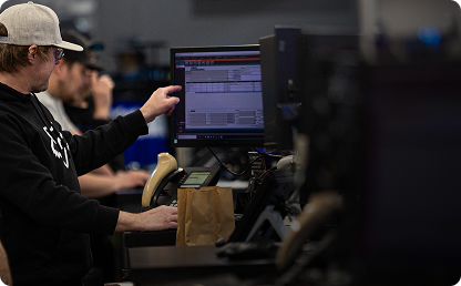 Image of a man pointing at a computer monitor. Image of a man pointing at a computer monitor.