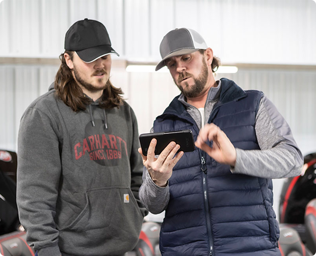 Two men looking at a tablet. Two men looking at a tablet.