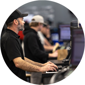 A Lightspeed employee using a computer. A Lightspeed employee using a computer.
