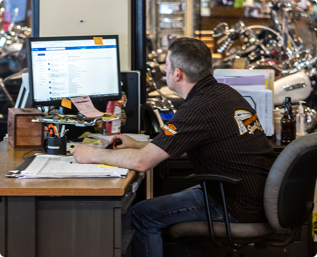 Image of a man working on a computer.